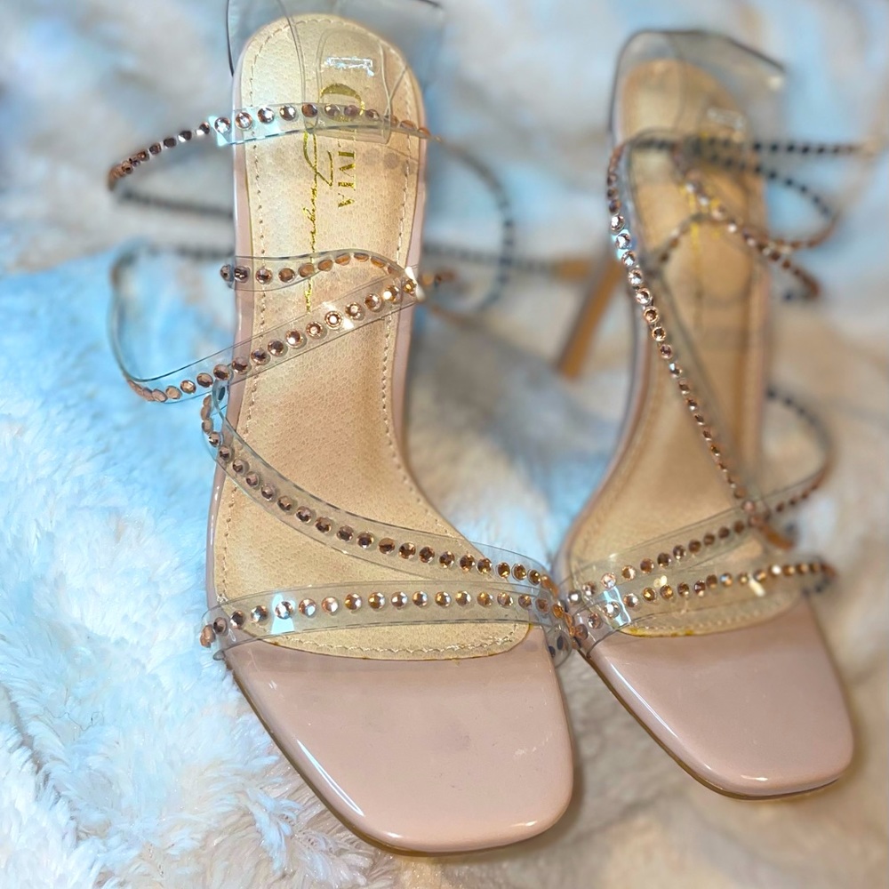Beautiful stud embellished strappy heels. Never worn.